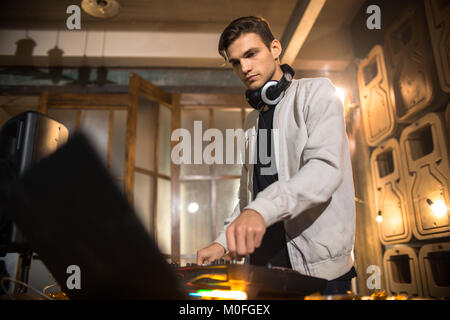Young DJ Playing in Club Stock Photo