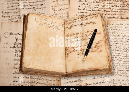 old copybook with fountain pen   on handwriting  background Stock Photo