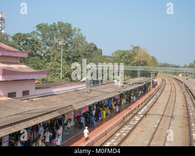 12/28/2017. Varkala, Kerala, India. People wait patiently for their train in one of the busiest train stations in Kerala. Stock Photo