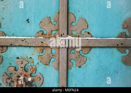 Abstract blue wood vintage background with rusty forged metal elements in winter. The horizontal frame. Stock Photo