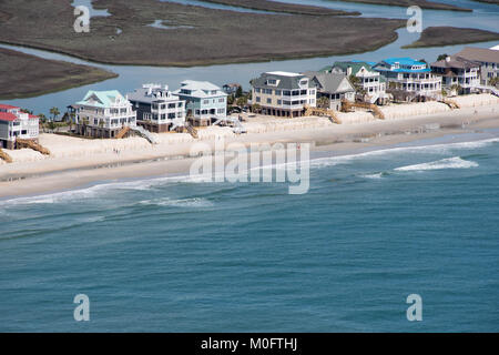 Stately beach homes look out onto the blue waters of Myrtle Beach, South Carolina Stock Photo
