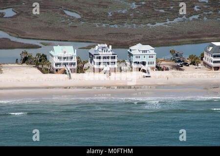 Stately beach homes look out onto the blue waters of Myrtle Beach, South Carolina Stock Photo