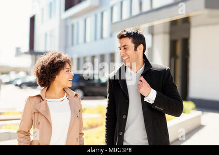 office workers or couple talking on city street Stock Photo