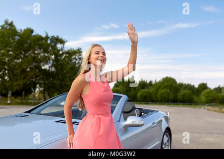 happy young woman in convertible car Stock Photo - Alamy