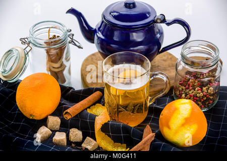 Cooked white wine with cinnamon, cloves, spices and orange peel Stock Photo