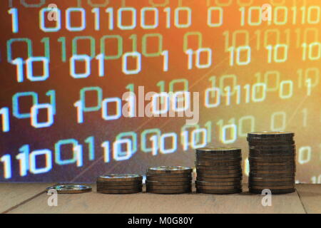 Digital economy. Financial data information value digital business concept. Coin stack increasing chart shape with orange light and binary. Stock Photo