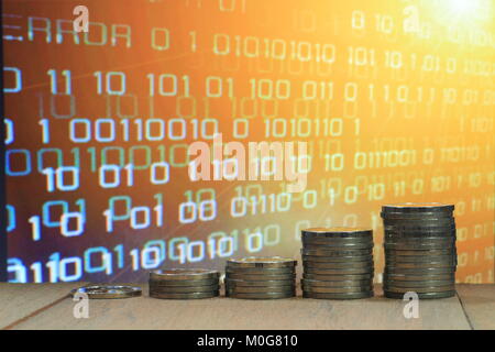 Digital economy. Financial data information value digital business concept. Coin stack increasing chart shape with orange light and binary. Stock Photo