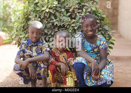 Three gorgeous African children posing outdoors Smiling and Laughing Stock Photo