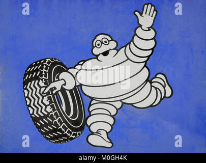 michelin tyre man logo on blue tinplate background Stock Photo