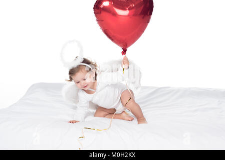 little angel with wings and nimbus holding heart balloon, isolated on white Stock Photo