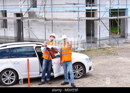 teamwork on the construction site - site manager and architect on site during the construction of a house Stock Photo