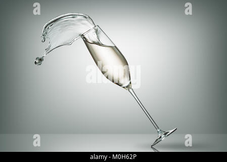 spilling champagne from falling glass on white Stock Photo