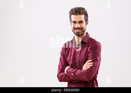 Studio shot portrait of young successful man. Stock Photo