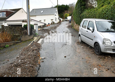 Debris surrounds a car on Corner Lane, Combe Martin, north Devon, after flooding affected parts of the south west, England. Stock Photo