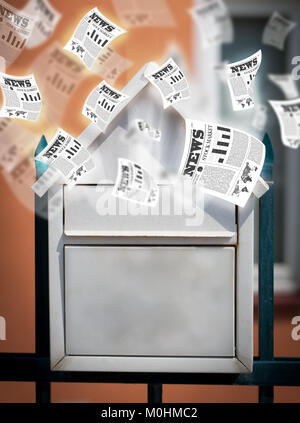 Post box with daily newspapers flying out Stock Photo