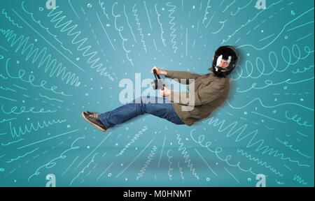 Funny guy drives an imaginary vehicle with drawn lines around him concept Stock Photo