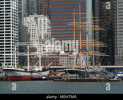 The 'Wavertree' And The 'Peking' clipper ships docked At The South Street Seaport Museum Pier 17 as seen from a ferry boat, East River, Lower Manhatta Stock Photo