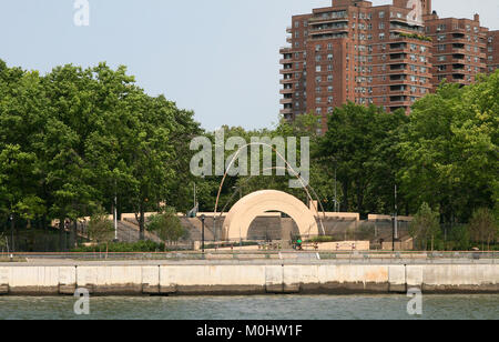 The East River Park Amphitheater seen from a ferry on the East River, Lower East Side Manhattan, New York City, New York State, USA. Stock Photo