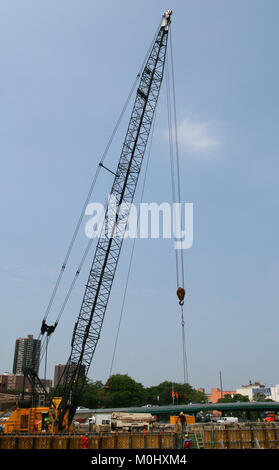 A floating crane on the Harlem River, Upper Manhattan, New York City, New York State, USA. Stock Photo