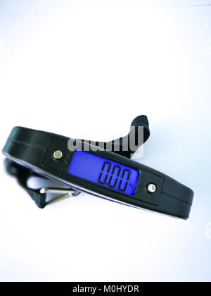 Compact portable luggage scales on white background Stock Photo - Alamy