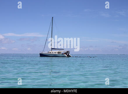 The Oceane V, a Catamaran Cruise boat in the open sea near the shores of Ile Aux Cerfs, The Republic of Mauritius, Flacq District. Stock Photo