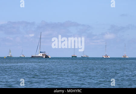 Catamaran yachts sailing in the open sea near the coast of The Republic of Mauritius. Stock Photo