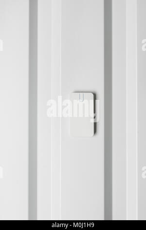 electronic door lock on white wall, home security concept Stock Photo
