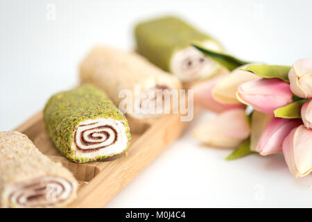 slice of Homemade Sweet roll with chocolate and vanilla on white background. Stock Photo