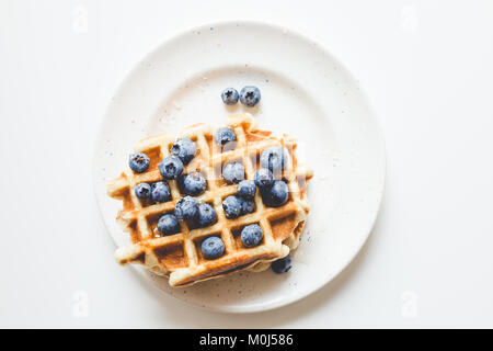 top view of stacked fresh waffles with blueberries Stock Photo