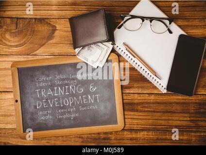 Business supplies and blackboard with plan written on it Stock Photo