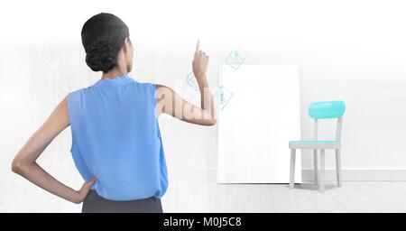 Woman pointing with blank canvas Stock Photo