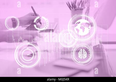 Hand using computer with graph overlays Stock Photo