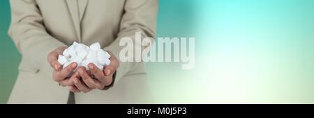 Sugar cubes in businesswoman's hands Stock Photo