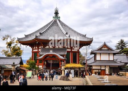 NARA, JAPAN - NOVEMBER 23, 2016: Tourists visit Kofuku-ji temple in Nara, Japan. The temple is part of Nara's UNESCO World Heritage Site. Stock Photo