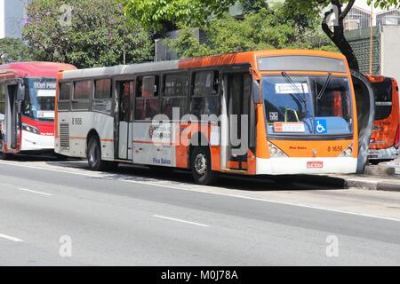 SAO PAULO, BRAZIL - OCTOBER 6, 2014: People ride a bus in Sao Paulo. There are some 17,000 buses in Sao Paulo. Stock Photo