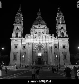 St. Stephen's Basilica at nighttime with tourists on the street; Budapest, Budapest, Hungary Stock Photo