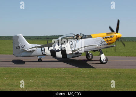 North American P-51D Mustang flown by the Old Flying Machine Company taxiing out at Duxford during a air display. Stock Photo