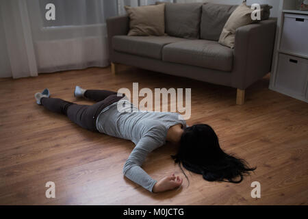 dead woman body lying on floor at crime scene Stock Photo