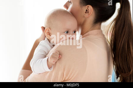 close up of little baby boy with mother Stock Photo
