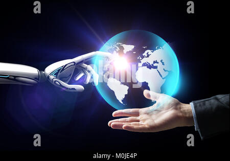 human and robot hand with virtual earth hologram Stock Photo