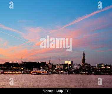 Panoramic picture of Hamburg harbor, Elbe river. View over the Elbe river towards Hamburg at sunset. Stock Photo