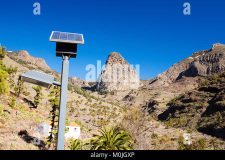 La Gomera landscape in Benchijigua, Canary Islands, looking towards the classic Roque de Agando with solar powered street lamps. Stock Photo