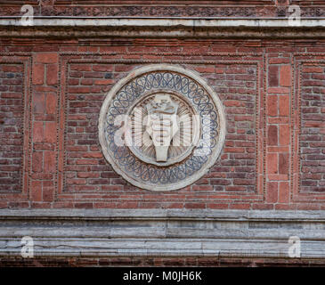 the snake, symbols of the ancient Lords of Milan, on the red brick wall of an ancient building Stock Photo