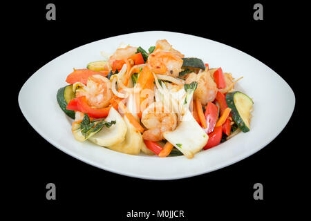 Shrimp stir fry  with vegetables over wood background Stock Photo