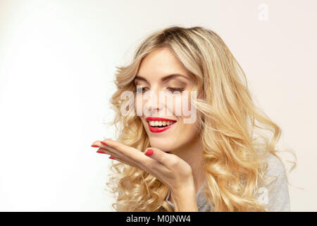 Beautiful blond woman with contact lenses box. Stock Photo