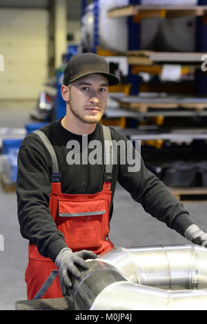 portrait of young apprentices in a metalworking company Stock Photo