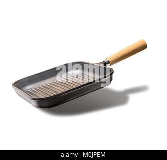 Flying empty grill or frying pan , isolated on white background, front view Stock Photo