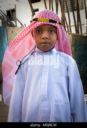 Kid wearing traditional suit for the Mawlid festival, Lamu Island, Kenya Stock Photo