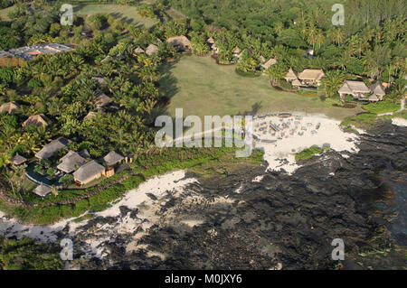 Aerial view thatch roofed beach lodge resort from helicopter, near the Le Morne Brabant peninsula, Riviere Noire District, The Republic of Mauritius. Stock Photo
