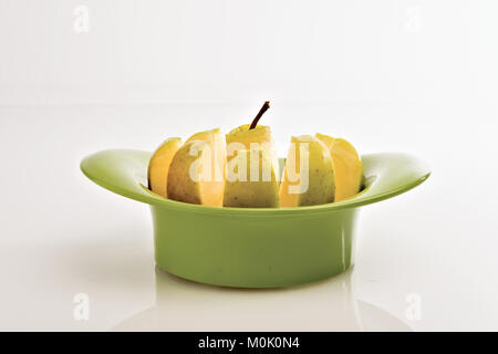 apple cut into wedges from below 2 Stock Photo